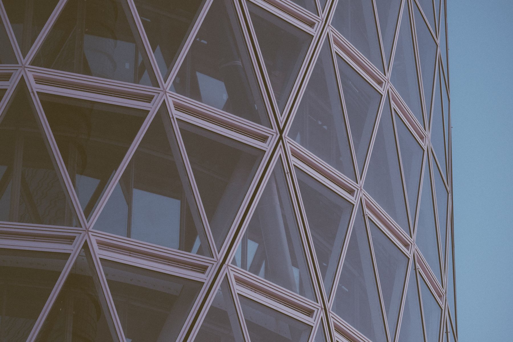 A geometric glazed commercial facade — illustrative architectural photography